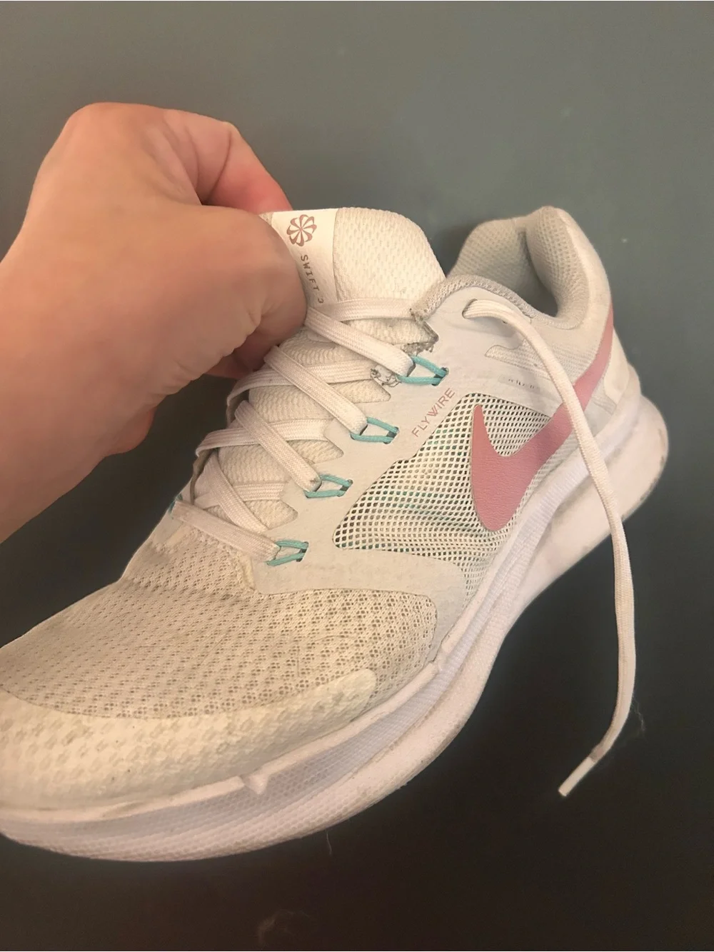 Nike Women's White Sneakers with Coral Swoosh and Teal Accents